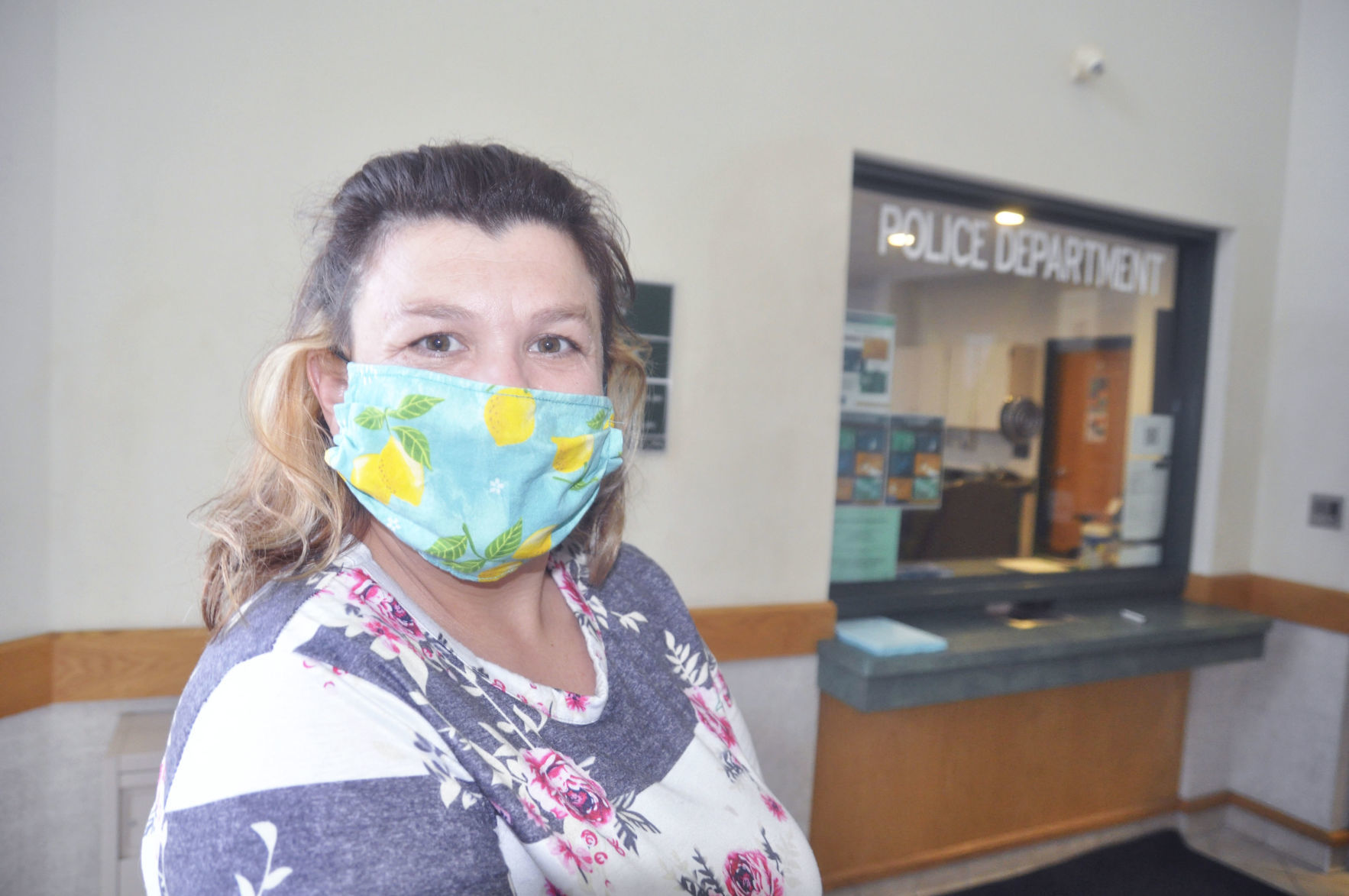 Voter wearing protective mask waits in line to vote